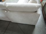 a white couch that is sitting in a room
