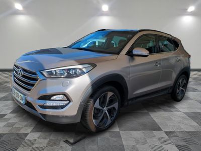 a silver 2017 hyundai tucson parked on a checkered floor