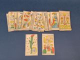 a lot of playing cards on a blue table