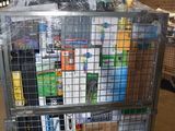 a metal cart with many items in it in a warehouse