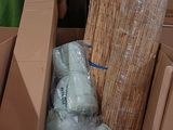 a large amount of boxes and bags in the back of a truck