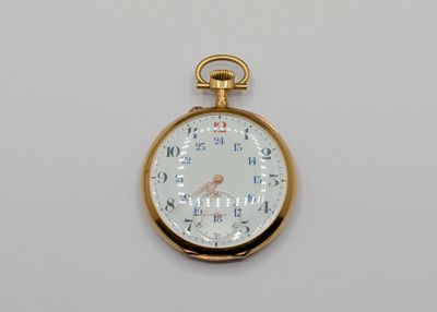 a gold pocket watch with a white face and numbers on it