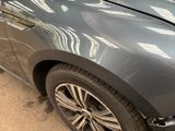 a close up of a car that has a denting on it