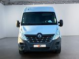 a silver van that is parked in a white room