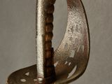 a close up of a metal object on a gray surface