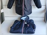 a picture of a jacket and a t - shirt on a table