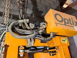 a picture of a crane that has a bunch of wires attached to it