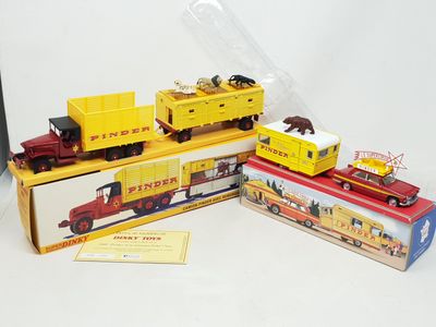 three toy trains sitting on top of each other on a table