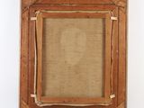 an old wooden frame with a picture hanging on the wall