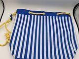a blue and white striped drawsack bag with yellow handles