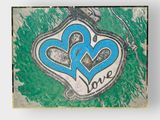painting of two blue hearts with the word love painted on them