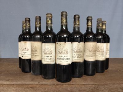 six bottles of wine sitting on top of a wooden table