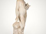 an image of a statue of a woman holding a dog