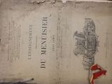 an old book with a red ribbon on top of it