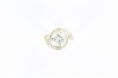 a close up of a diamond ring on a white background
