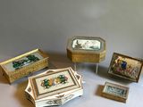 four boxes with pictures on them sitting on a table