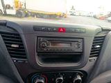 a dashboard of a car with a radio in it