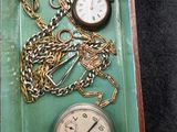 a tray that has a bunch of different clocks on it