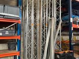many shelves in the warehouse with many items on them