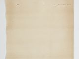 an old piece of paper on a white surface with a piece of paper sticking out of it