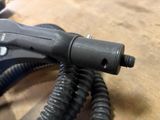 a close up of a corded hair dryer on a table
