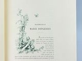 an open book with a picture of a bird on it