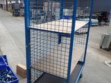 a blue cart with a bunch of screws in it