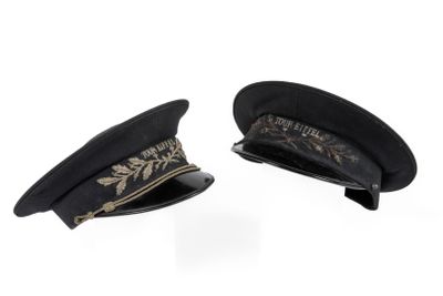 pair of black hats with gold embroidery on them on a white background