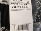 a black and white sock with a tag on it