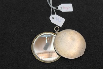 a locke with a mirror and a tag on it