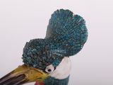 a statue of a bird with a very long beak