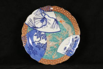 a blue and white plate with a design on it