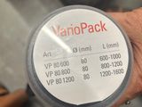 a person holding a jar with a sticker on it