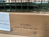 a bird in a cage sitting on top of a box