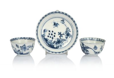 three blue and white bowls and a bowl on a white surface