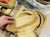 a person that is holding some baskets in their hand