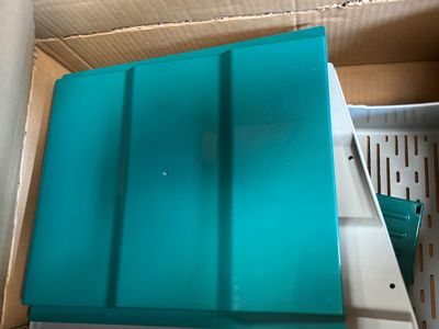 a box with a blue lid that is inside of it