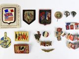 a lot of pins and badges on a white surface