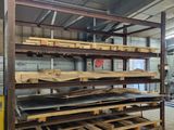 many pallets of wood stacked on the pallets in the warehouse