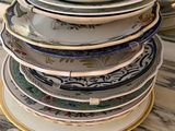 many plates stacked on top of each other on a table