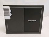 the back of a black box with a white sticker on it