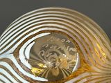a white and gold glass vase with a gold design on it
