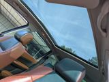 a view of the inside of a car from the driver ' s seat