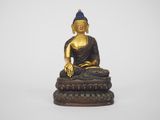 an image of a statue of a buddha sitting on a pedestal