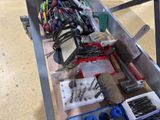 a table with tools on it in the middle of a room