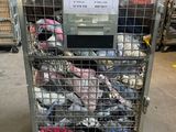 a cart with a lot of shoes in it in a warehouse