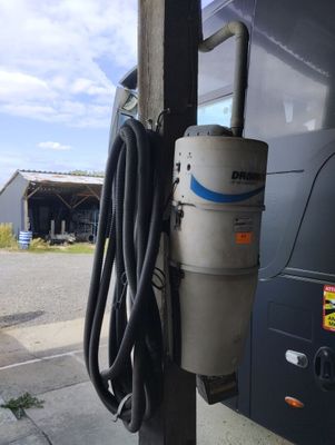 a gas pump attached to the side of a bus