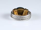 a close up of a ring on a white surface