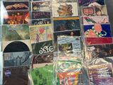 a lot of cds and cds on the table