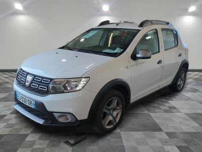 the white dacia is parked on a checkered tile floor